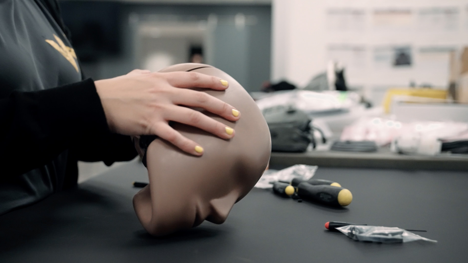 Hands handling a dummy test head