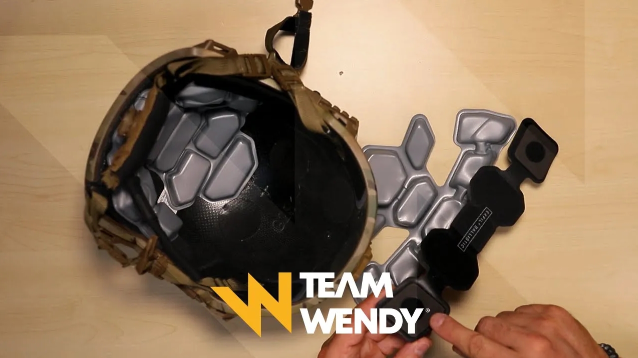 Person installing a maritime liner into a Team Wendy EXFIL LTP helmet