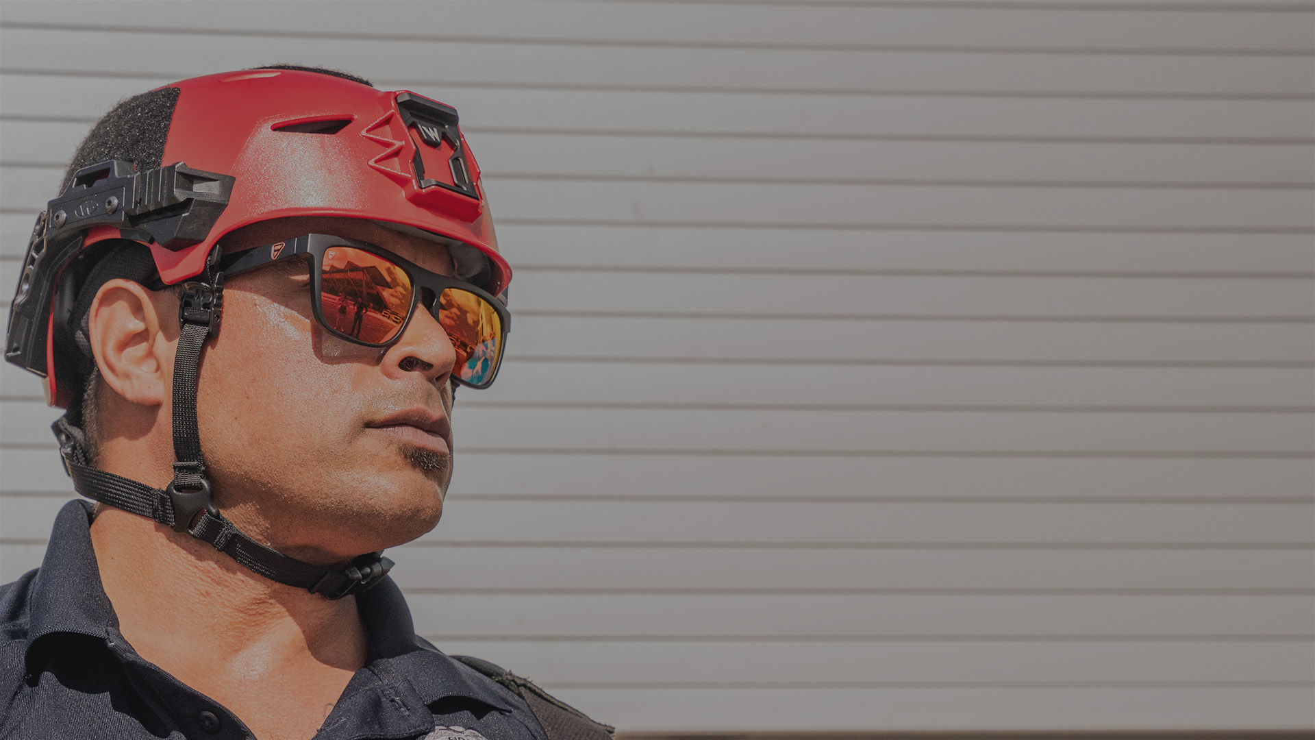 Firefighter wearing a red Team Wendy Rescuer helmet